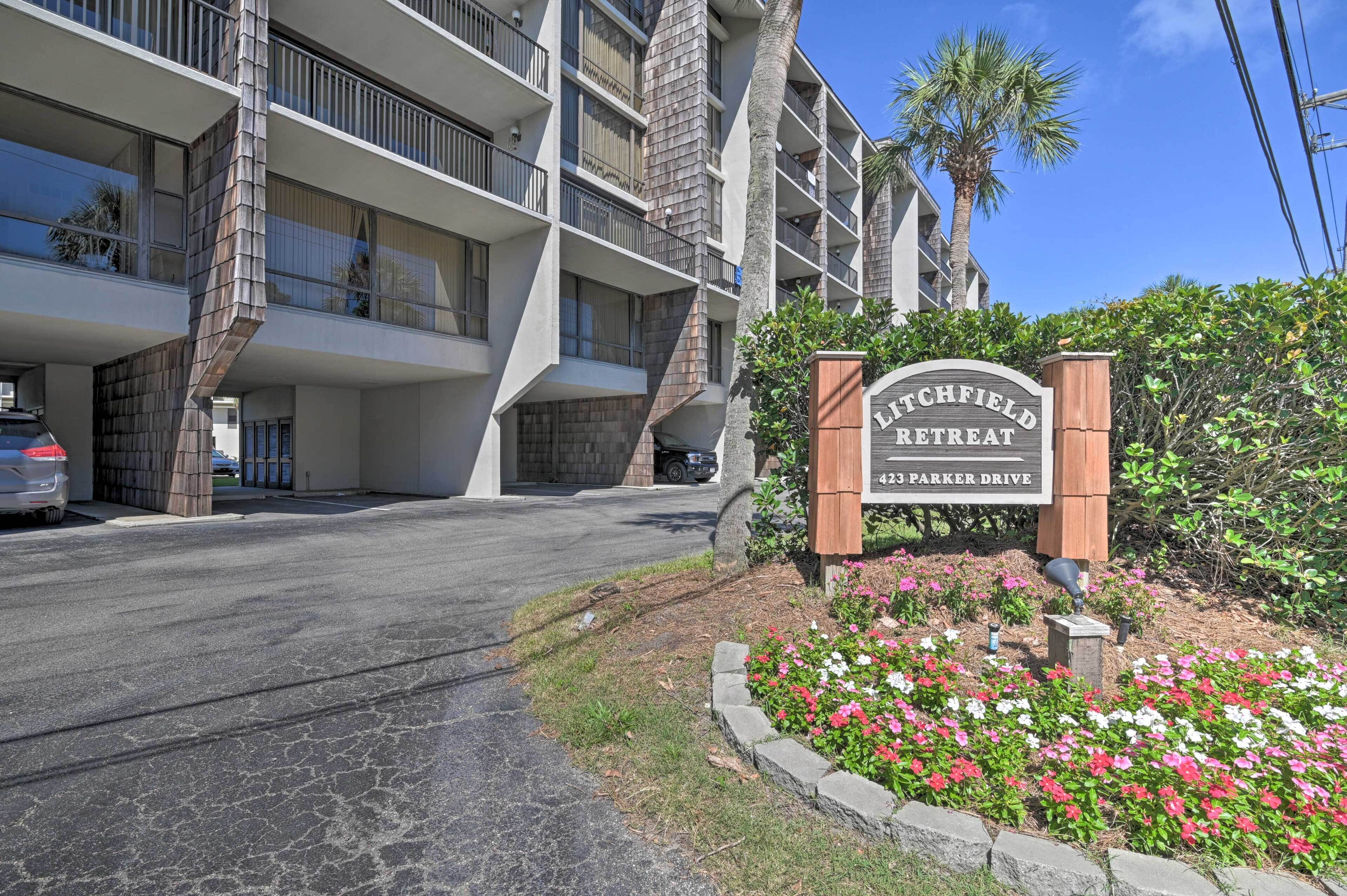 A multi-story hotel with a sign reading "Litchfield Retreat 423 Parker Drive".