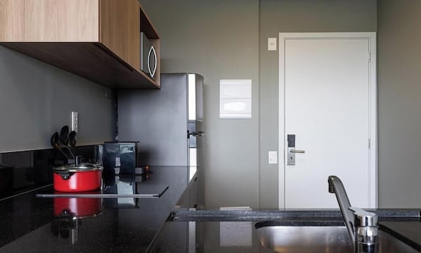 Basic Apartment | Private kitchen | Coffee/tea maker, full-size fridge, microwave, stovetop