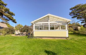 A small, single-story house with a large glass window and a white roof. - Pet friendly home in Skummeslövsstrand (Skummeslövsstrand)