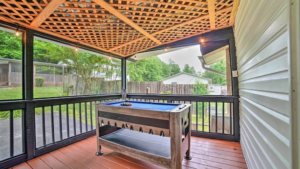 A covered outdoor area with a pool table, wooden deck, and a view of a backyard. - 'creekside Ranch' w/ Porch ~ 2 Mi to Pkwy (Pigeon Forge)