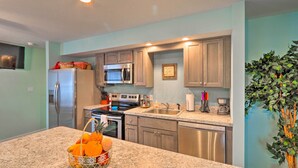 A modern kitchen with granite countertops, stainless steel appliances, and light blue walls. - Unwind Fireside! Poconos Cottage 12 Mi to Slopes (Brodheadsville)