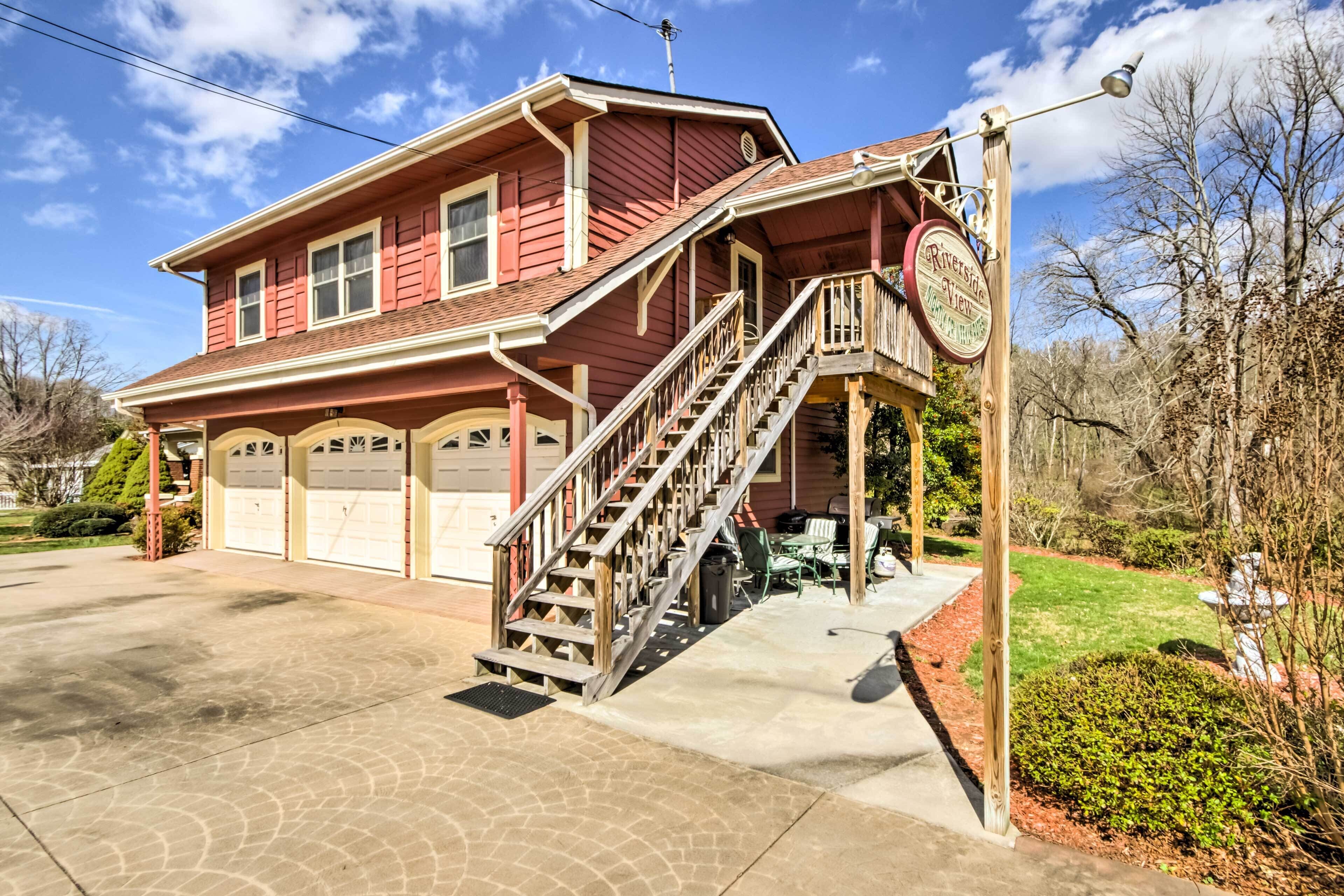 A two-story house with a covered porch, a staircase, and a garage.