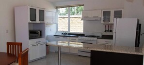 Family Cabin, Multiple Beds | Private kitchen | Full-size fridge, microwave, oven, stovetop