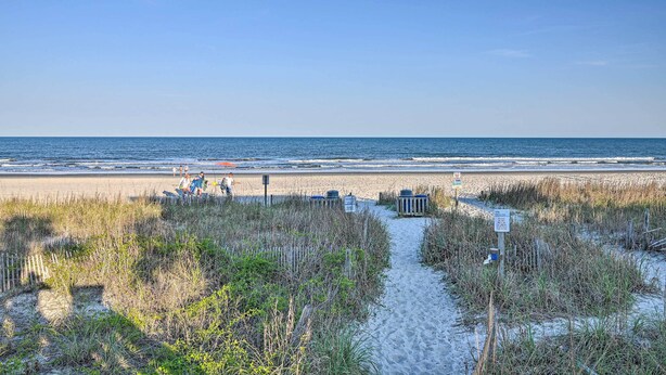 A beach path leading to the ocean with a clear sky. - Eclectic Condo w/ Balcony: 1 Block to Beach! (Surfside Beach)