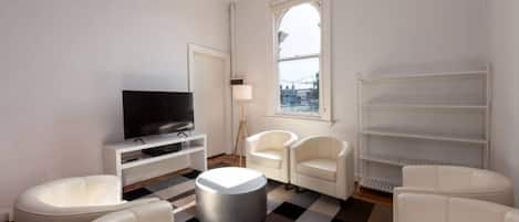 Appartement, plusieurs lits | Coin séjour
