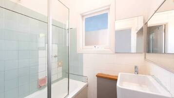 Basic Apartment, Multiple Beds | Bathroom | Shower, towels, soap, shampoo