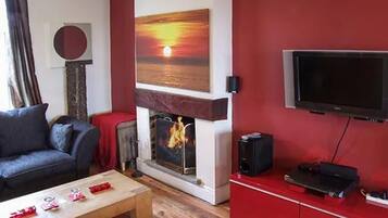 Cottage, Multiple Beds | Living area | Fireplace