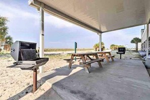 Enjoy al fresco dining on the covered patio, complete with a barbecue grill and picnic tables.
