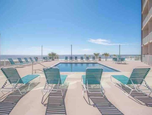 Relax by the ocean with a poolside view from the comfort of your own space.