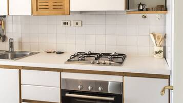 Fridge, oven, dishwasher, dining tables