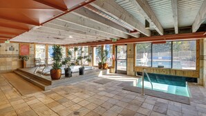 A pool area with steps leading to the water, potted plants, and a view of the outside. - 1 Mi to Keystone Ski Lift: Lakefront 4-season Gem (Keystone)
