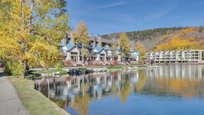 A lakeside hotel with multiple buildings, a clear view of the lake, and a surrounding autumnal landscape. - 1 Mi to Keystone Ski Lift: Lakefront 4-season Gem (Keystone)