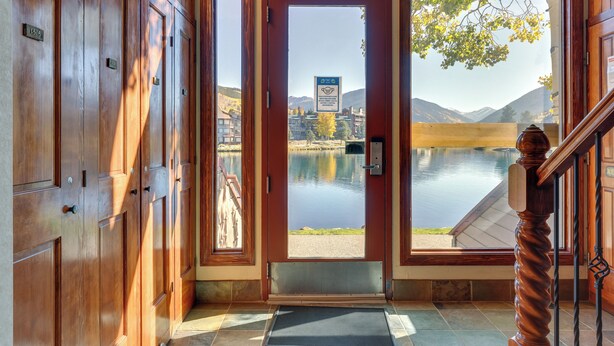 A wooden door with a view of a lake and mountains. - 1 Mi to Keystone Ski Lift: Lakefront 4-season Gem (Keystone)
