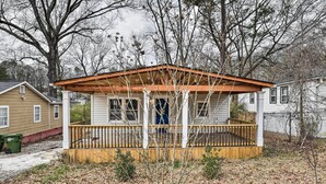 A small wooden structure with a porch, surrounded by leaf-covered ground and bare trees. - Charming Atlanta Vacation Home ~ 5 Mi to Dtwn (Atlanta)