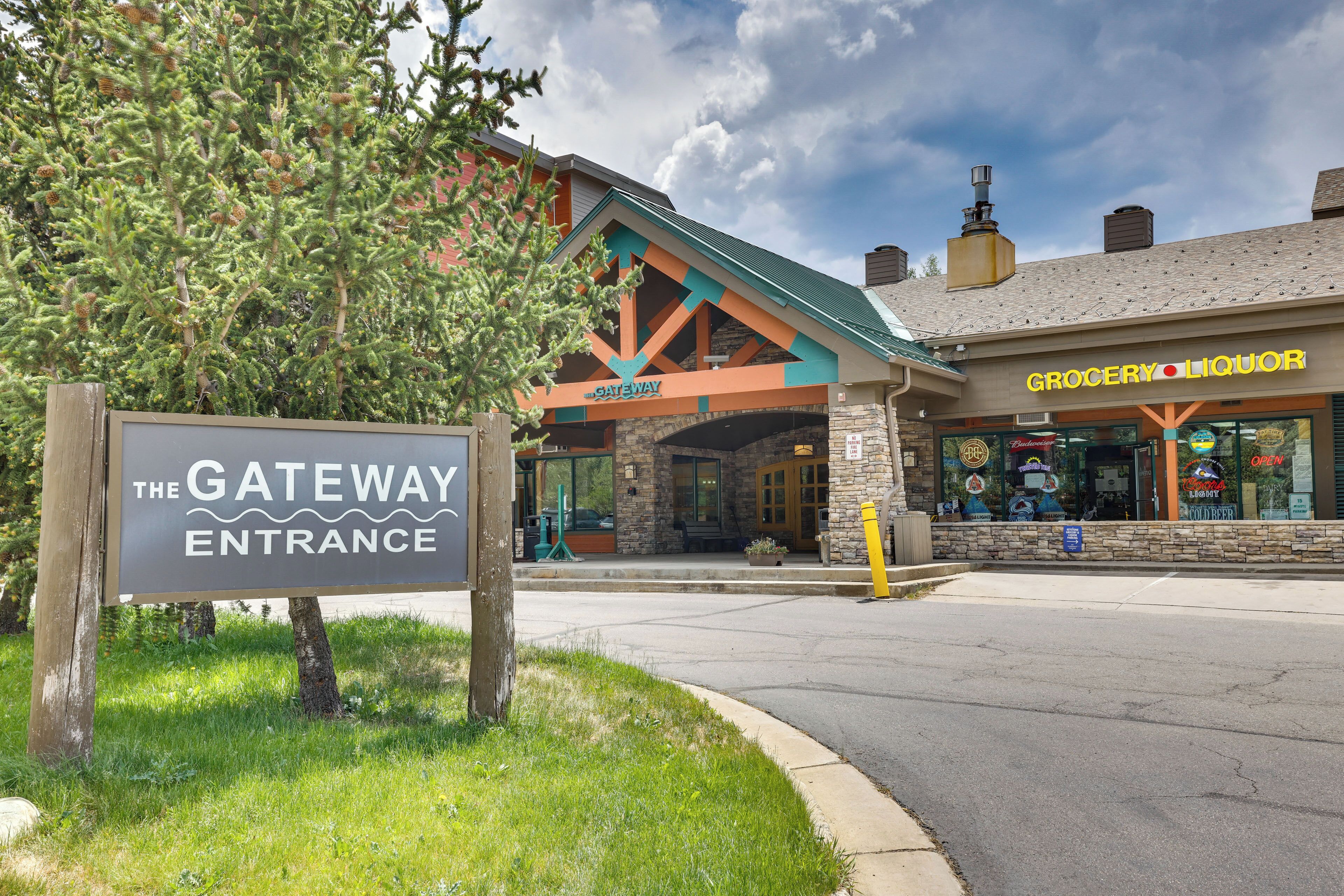 A building with a sign reading 'The Gateway Entrance' and a storefront labeled 'Grocery Liquor.'