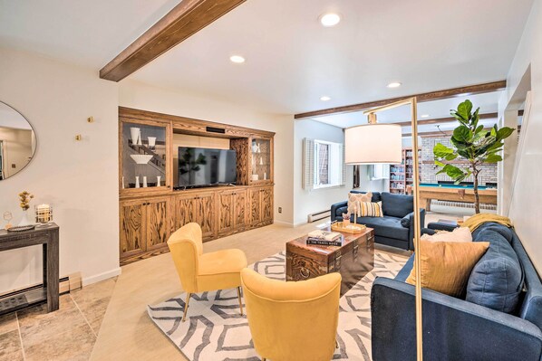Apartment (2 Bedrooms) | Living area | Fireplace, books - Luxe Garden-level Apartment w/ Sauna & Gym! (Colorado Springs)