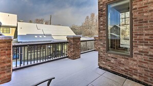 A covered outdoor area with a brick wall and a large window. - 1/2 Mi to Dtwn: Golden Gem w/ Patios! (Golden)