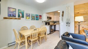 A compact living space with a dining area, kitchenette, and seating area. - Quaint Winter Park Townhouse < 5 Mi to Ski! (Winter Park)