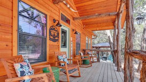 A wooden cabin with a porch, rocking chairs, and a sign that reads "Welcome". - 'lakewood Secret' Cabin ~ 4 Mi to The Lake! (Canyon Lake)