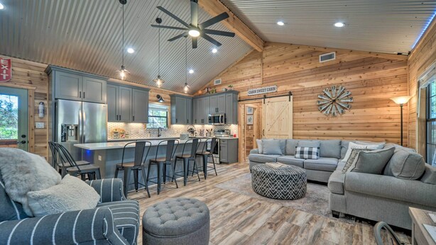 A spacious cabin interior with a kitchen, dining area, and seating area. - 'lakewood Secret' Cabin ~ 4 Mi to The Lake! (Canyon Lake)