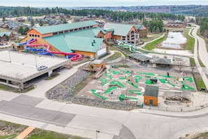 A large building with multiple slides and a playground area. - Resort Cabin w/ Lake Access in Central Warrens! (Warrens)