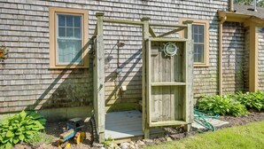 A wooden shed with a door, a window, and a small step leading up to it. - Game Room + Patio: Quiet Centerville Beach Base (Centerville)