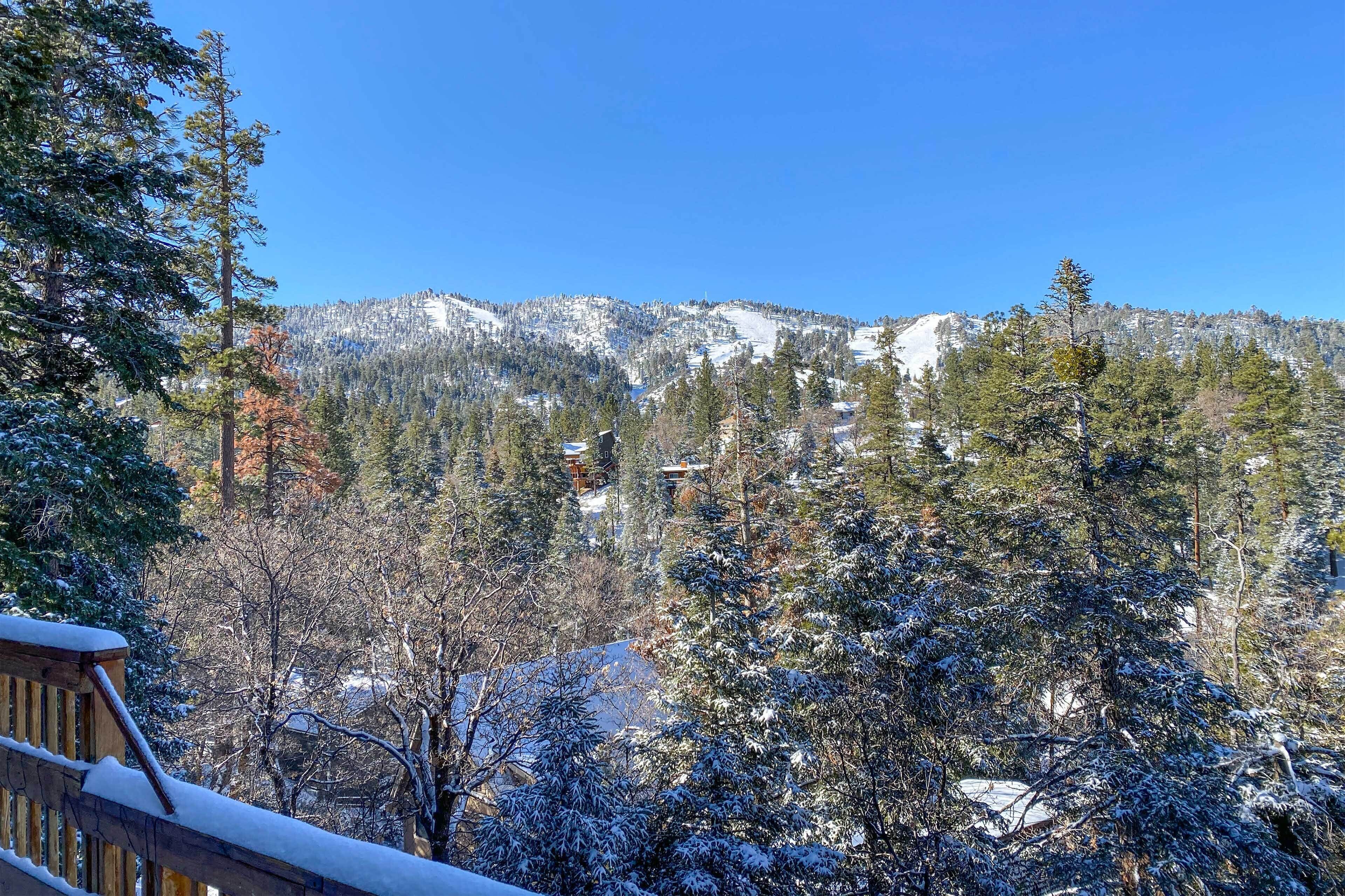 A snowy mountain landscape with a clear sky.