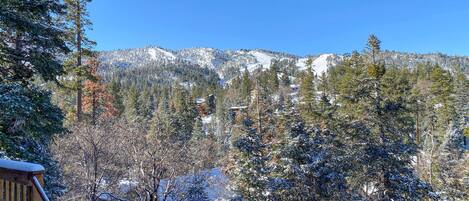 A snowy mountain landscape with a clear sky.