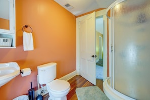 A bathroom with a toilet, sink, and shower. - Walkable, Modern! Old Louisville Victorian w/ Yard (Louisville)