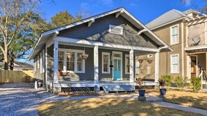 A two-story house with a porch, a front door, and a small front yard. - Renovated Historic Home w/ Yard: 2 Mi to Dtwn (Mobile)