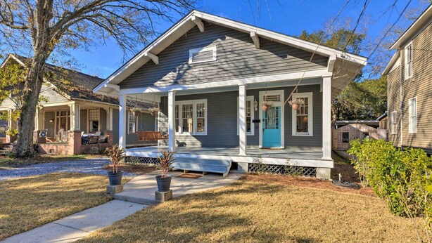 A two-story house with a porch, a front door, and a small front yard. - Renovated Historic Home w/ Yard: 2 Mi to Dtwn (Mobile)