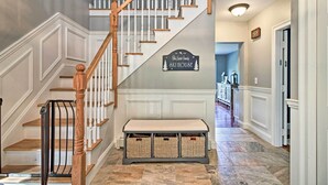 A staircase with wooden railings and a bench at the bottom. A sign above the staircase reads "The Ski House." - West Dover Home - 3 Miles to Mount Snow Resort! (West Dover)