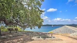 A park with benches and a view of a body of water and a dam. - Cozy Canyon Lake Cottage: 1 Mi to Guadalupe River! (Canyon Lake)