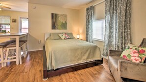 A bedroom with a bed, a desk, and a chair. - Cozy Canyon Lake Cottage: 1 Mi to Guadalupe River! (Canyon Lake)