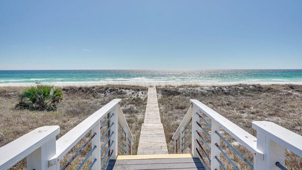 A wooden boardwalk leading to a beach with a clear view of the ocean. - Breezy PCB Retreat w/ Direct Beach Access! (Panama City Beach)