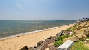 A beach with clear water, sandy shore, and rocky outcrops. - Pool & Beach Access: Coastal Condo in Provincetown (Provincetown)