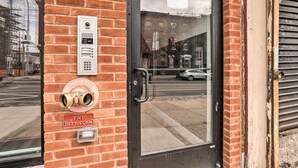A fire department entrance with a glass door, a fire alarm panel, and a brass fire hydrant. - Trendy Apt w/ Laundry Machines < 3 Mi to Dtwn (Philadelphia)