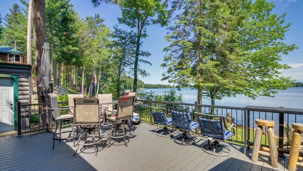 A deck with outdoor furniture and a view of a lake. - Pequot Lakes Cabin w/ Dock on Loon Lake! (Pequot Lakes)