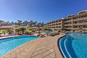 A hotel with multiple swimming pools, outdoor seating areas, and a landscaped garden. - 30A Retreat w/ Patio & Resort Amenities! (Santa Rosa Beach)