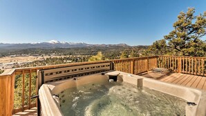 A hot tub on a wooden deck with a mountain view. - Ruidoso Home w/ Hot Tub, Mtn Views & Game Room! (Ruidoso)