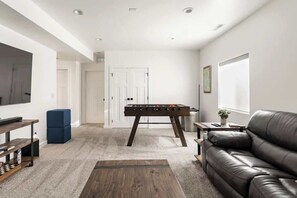 Smart TV, fireplace, table football, books