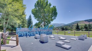 An outdoor playground with climbing structures and seating areas. - Renovated Avon Condo 5 Mins to Beaver Creek Resort (Avon)