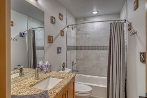 Combined shower/tub, hair dryer, towels, soap