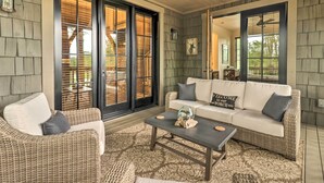 A cozy living room with wicker furniture, a glass coffee table, and a large window with blinds. - Hike, Fish & Golf! Serene Mtn Retreat in Glenville (Glenville)