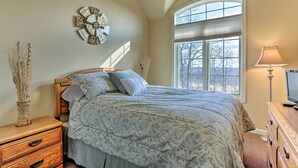 A bedroom with a bed, wooden nightstands, a dresser, a decorative wall clock, and a window with blinds. - Townhome w/ Grill < 1 Mi to Big Boulder Mountain (Lake Harmony)