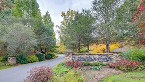 A landscaped entrance with a stone sign reading "Mountainview."