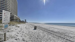 A beach with a sign indicating water closed to public and rip currents. - 1st-floor Resort Condo in PCB - Walk to Beach! (Panama City Beach)