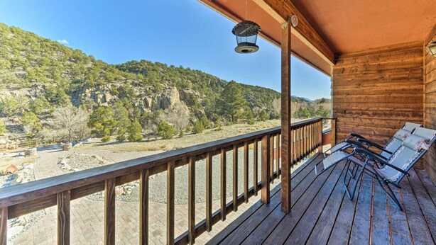 A wooden deck with a railing overlooking a mountainous landscape. - ~ 1 Mi to Downtown: Buena Vista Riverfront Escape! (Buena Vista)