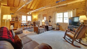 A log cabin interior with a living room, dining area, and kitchen. - Picturesque Log Cabin in Estes Park: 9 Mi. to Rmnp (Estes Park)