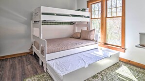 A bunk bed with a window on the right side. - Pocono Retreat, 1 Mi to State Park & Ski Access! (Tannersville)